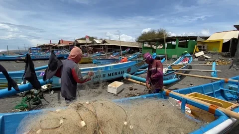 Fishermen are tidying up their nets Stock Footage 294739906