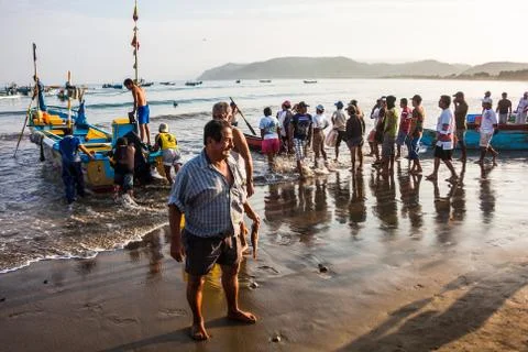 Fishermen on the beach Stock Photos