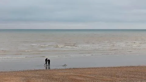 Fishermen on the beach Stock Photos