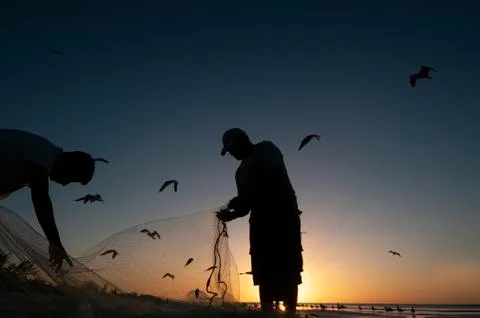 Fishermen on the beach Fotos de archivo