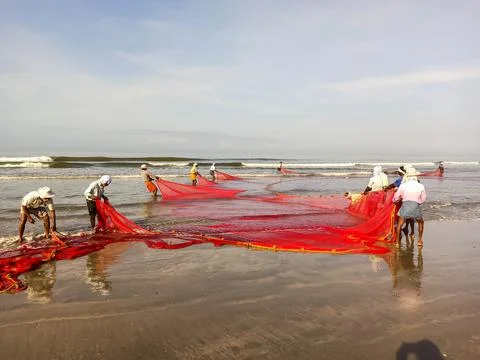 Fishermen at beach Stock Photos