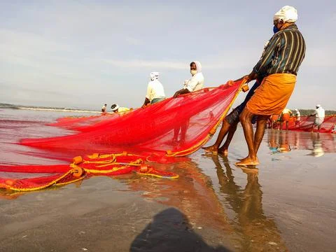 Fishermen at beach Stock Photos