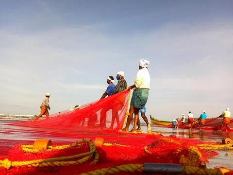 Fishermen at beach Stock Photos
