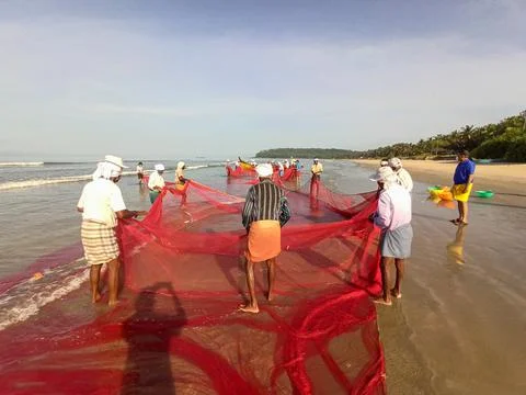 Fishermen at beach Stock Photos