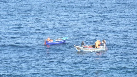 Fishermen with boat working with nets Video stock 123325847