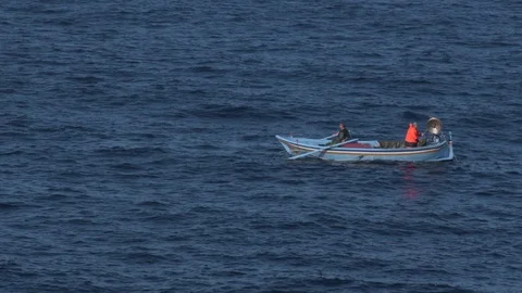 Fishermen with boat working with nets Video stock 123330853