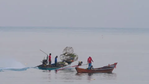 Fishermen boating with crab nets Stock Footage 308582401