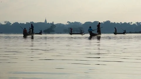 Fishermen in canoes Stock Footage