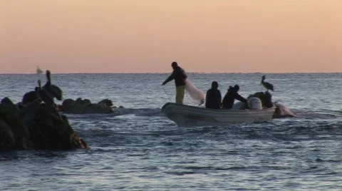 Fishermen Casting Net In Waves Near Rocks Stock-Footage 1012463