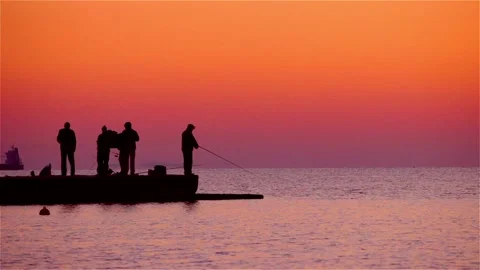Fishermen catch fish at sunrise Stock Footage