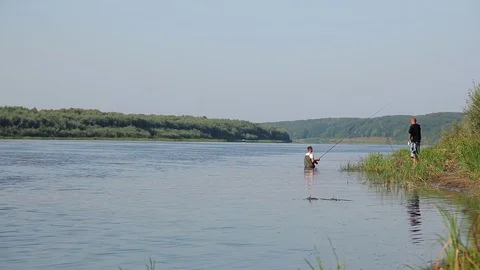 Fishermen catch fish using fishing rod Stock Footage 79342002