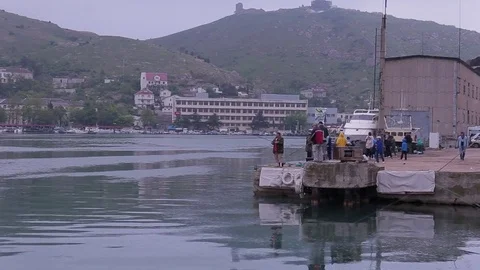Fishermen catching fish on the pier Stock Footage 76249153