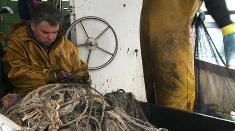 Fishermen cleaning nets 6 Stock-Footage 31269043