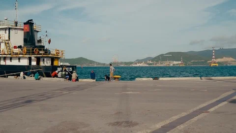 Fishermen on the dock. The first perspective of a person who approaches the p Stock Footage 102307191