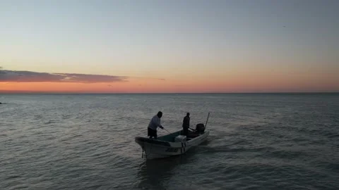 Fishermen Docking boat during sunset in Mexico Stock Footage 233427887