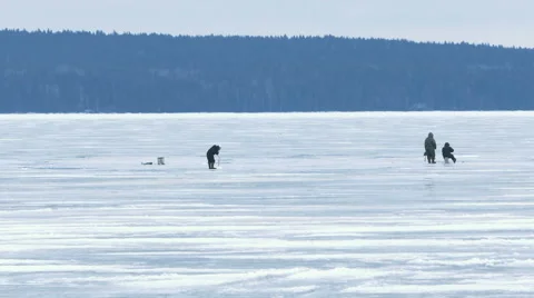 Fishermen on Ice at Frozen Lake in Winter Video stock 59665953