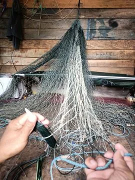 Fishermen make nets to catch fish. Foto stock