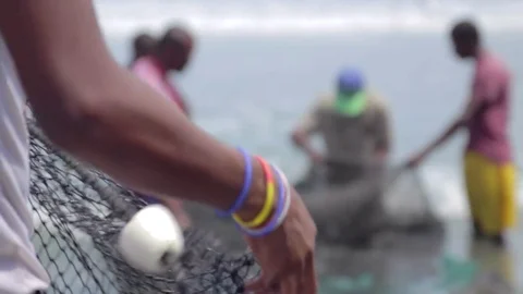 Fishermen with nets on the seashore Video stock 75167227