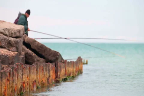 Fishermen on old rusty pier Stock Footage