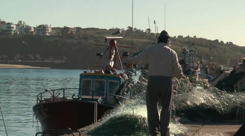Fishermen preparing net in sines harbor, portugal closeup Stock Footage 33779348
