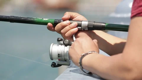 Fishermen pull the fish they catch with their fishing line Stock Footage 139390259