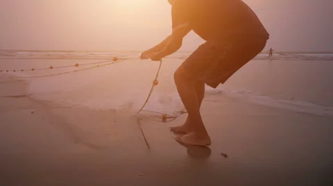 Fishermen pull net from the ocean Stock Footage 62641608