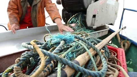 Fishermen pull out fishing nets on boat Stock Footage 85299440