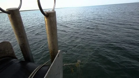 Fishermen pull out fishing nets on boat Stock Footage 85300220