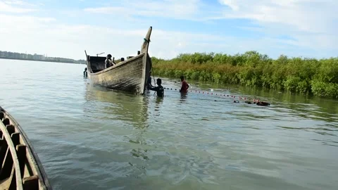 Fishermen Pulling Large Fishing Net in River During High Tide Stock Footage 319461822