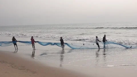 Fishermen pulling in net, puri , orissa, india Stock Footage 168117633