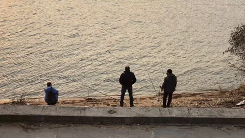 Fishermen on the river bank Stock Footage 111180655