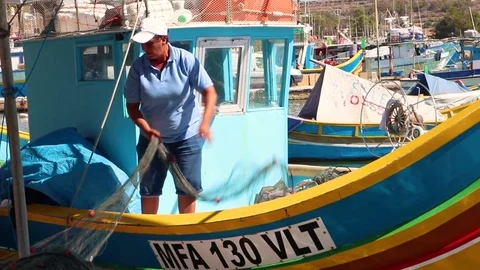 Fishermen Sort Out The Nets And Gear Preparing For Fishing Stock Footage 99686004