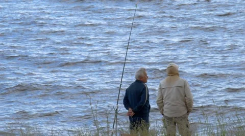 Fishermen stand and talk Stock-Footage 64582350