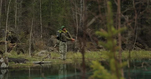 Fishermen on the stones catch fish in the rough water. Stock Footage 62996911