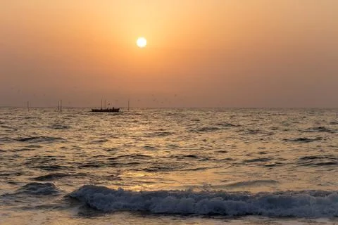 Fishermen at sunrise Фото