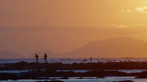 Fishermen at sunset 1 Stock Footage 300277339