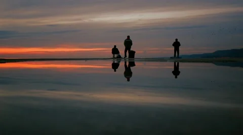 Fishermen at sunset. Stock Footage 60720436