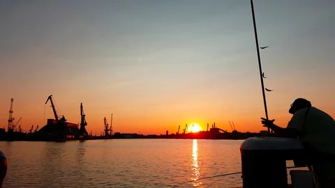 Fishermen at sunset Stock Footage 76966110