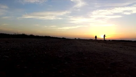 Fishermen at sunset Video stock 91558844