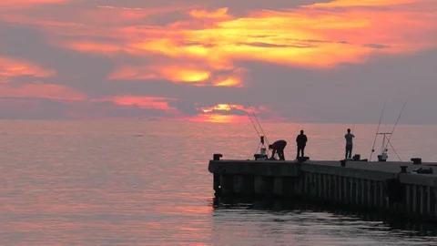 Fishermen at sunset Stock Footage 95044703