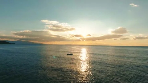 Fishermen throwing net into the sea at sunset 4K Drone Shot-2 Stock Footage 146689883