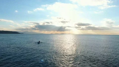 Fishermen throwing net into the sea at sunset 4K Drone Shot-6 Stock Footage 146696237
