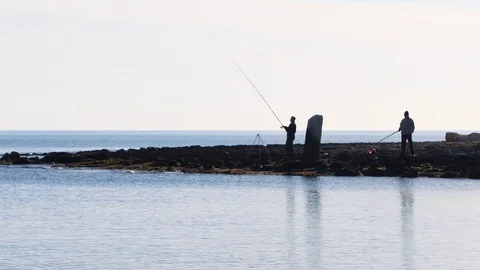 Fishermen waiting Stock Footage 105325779