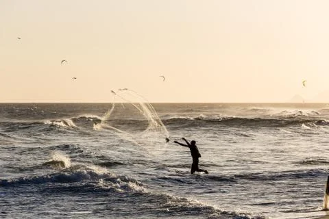 Fishermen at work during sunset Stock Photos