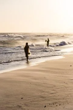 Fishermen at work during sunset Stock Photos