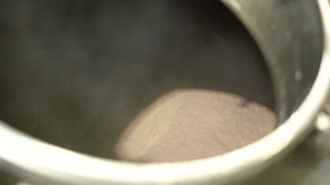 Fishery industry: a fish slurry machine, processing fish parts into a 動画素材 257916772