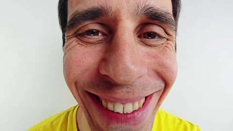 Fisheye Close-Up of Smiling Mans Comically Distorted Face Stock Footage 312473142