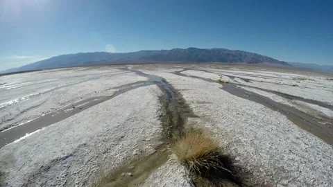 Fisheye of Desert Flat Bed Water Trickle Stream Salt Crust Curved Earth Alkaline Stock Footage 134528426