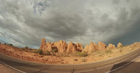 Fisheye storm clouds over red rocks and road 4k timelapse Video stock 11765124