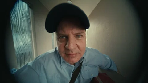 Fisheye view of Mailman knocking on the door Stock Footage 263971705